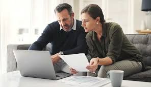 Two professionals reviewing documents together